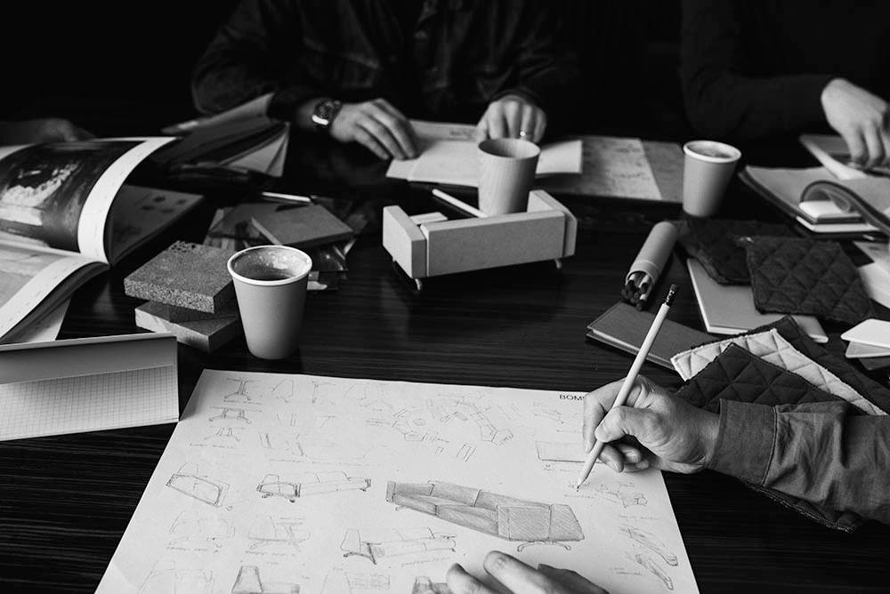 body part, finger, hand, person, pen, furniture, table, cup