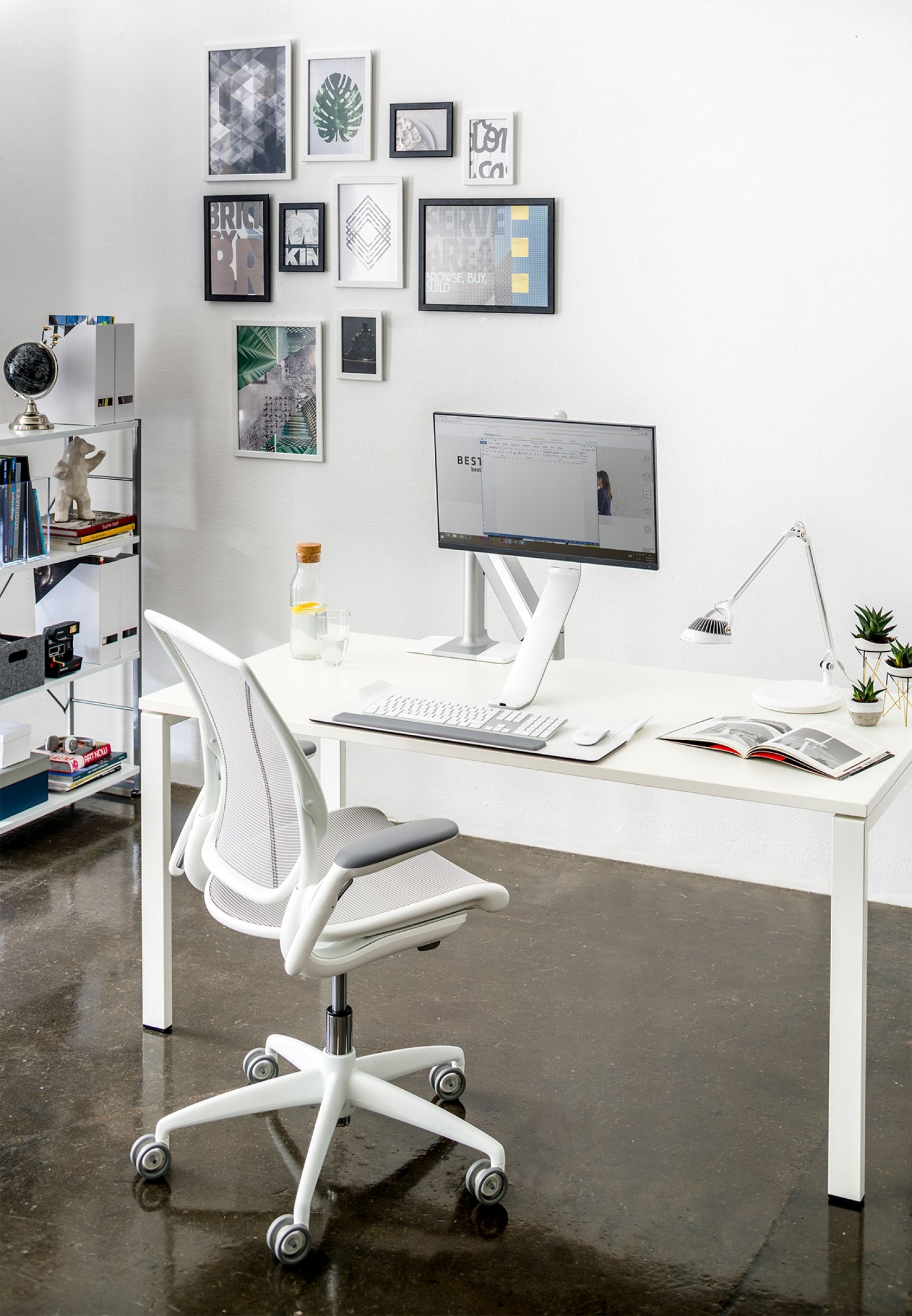 furniture, table, desk, computer keyboard, indoors, chair, monitor, book, painting, person