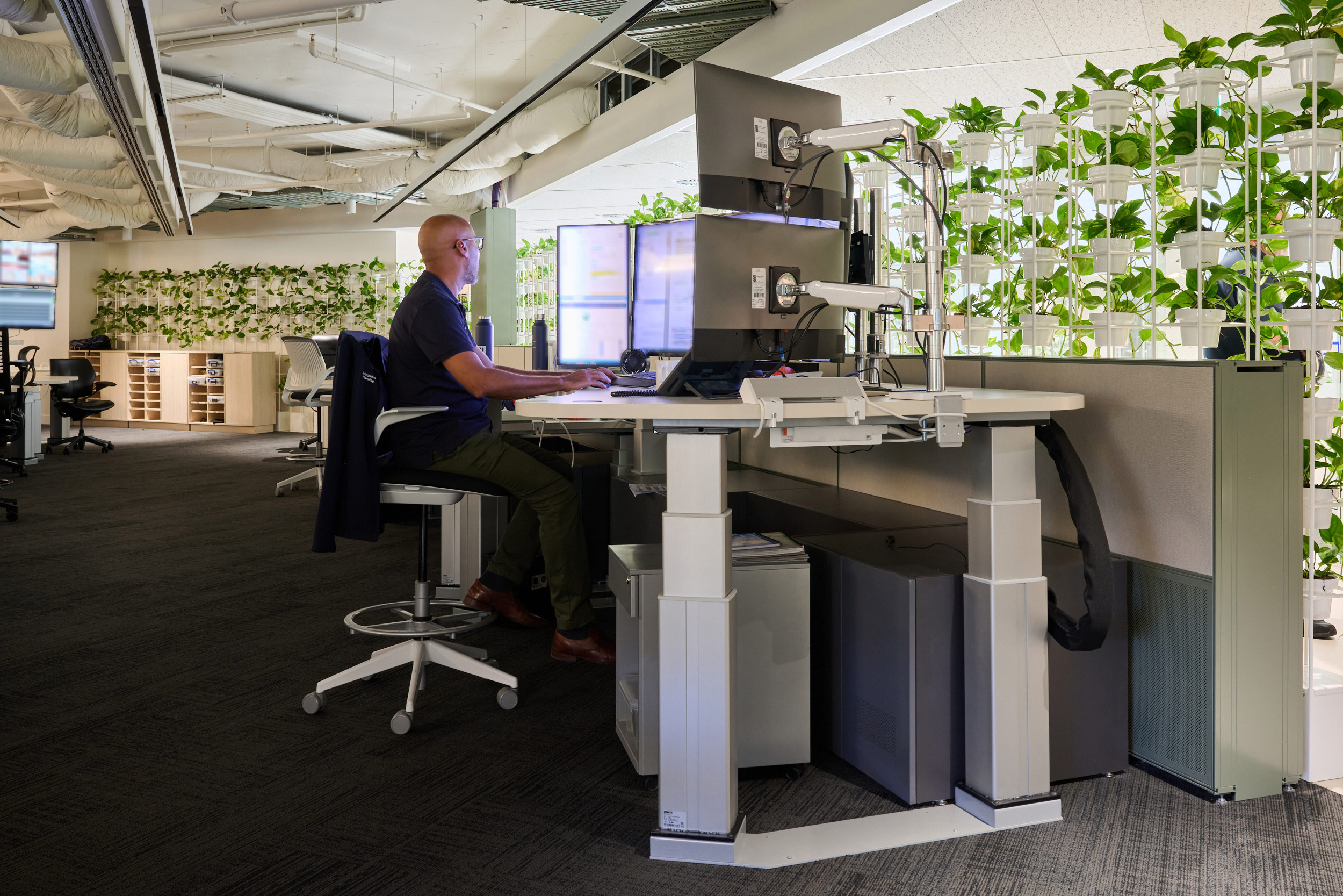 furniture, table, desk, chair, adult, male, man, person, shoe, indoors