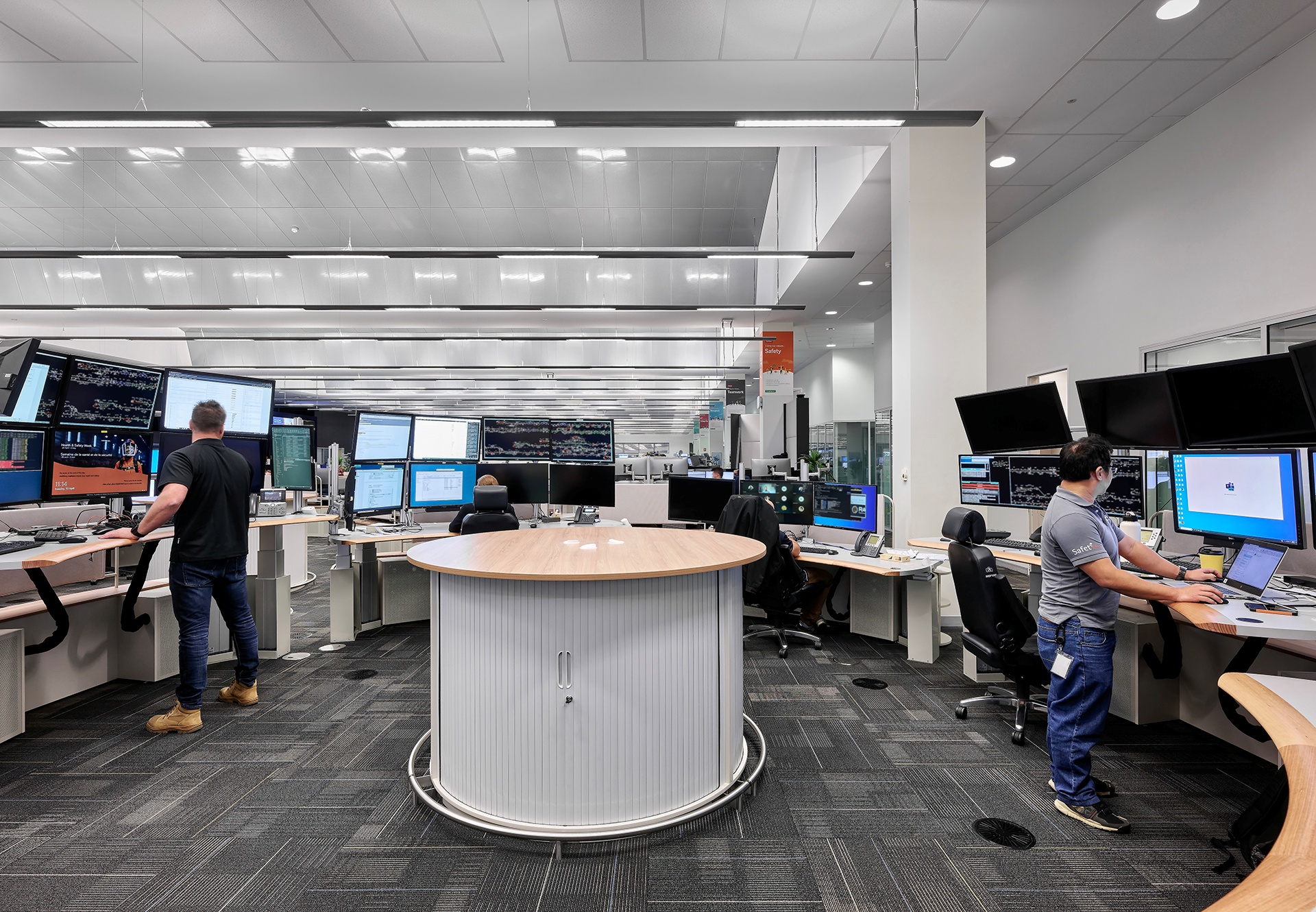 furniture, table, desk, person, adult, male, man, shoe, indoors, chair