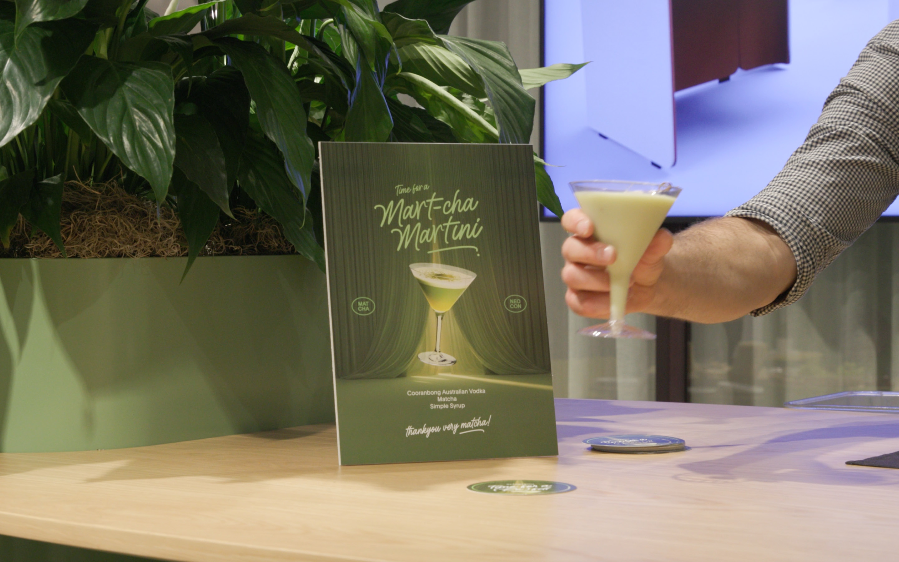 book, publication, person, glass, advertisement, plant, potted plant, furniture, table, herbal
