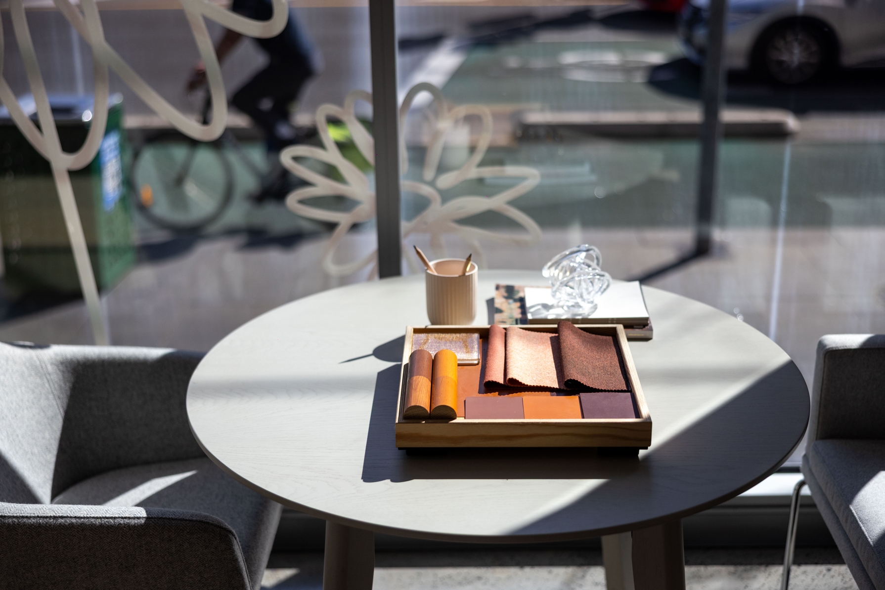 furniture, table, coffee table, tabletop, desk, chair, dining table, person, cup, car